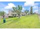 A manicured lawn and mature trees enhance this townhome community's curb appeal at 4920 Larkspur St, Las Vegas, NV 89120