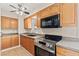 Detailed view of the kitchen showcasing stainless steel appliances and ample cabinet space at 4920 Larkspur St, Las Vegas, NV 89120