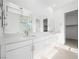 Bright bathroom featuring double vanity with stone countertops and modern fixtures at 50 Barrio Alto Ct, Henderson, NV 89011