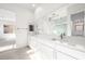 Bright bathroom featuring double vanity with stone countertops and modern fixtures at 50 Barrio Alto Ct, Henderson, NV 89011
