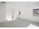 Bright, carpeted bedroom with neutral walls and minimalist design at 50 Barrio Alto Ct, Henderson, NV 89011