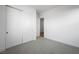 Bright, carpeted bedroom with neutral walls and double door closet at 50 Barrio Alto Ct, Henderson, NV 89011