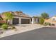 Beautiful single-story home with a three-car garage, desert landscaping, and mountain views at 50 Barrio Alto Ct, Henderson, NV 89011