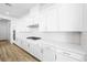 Modern kitchen with white cabinets, stainless steel appliances, and quartz countertops at 50 Barrio Alto Ct, Henderson, NV 89011
