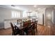 Open dining room with wood floors, modern cabinets and lighting, and neutral paint at 5000 Charlo Dr, Las Vegas, NV 89131