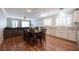 Open-concept dining area with hardwood floors and lots of natural light and white cabinets at 5000 Charlo Dr, Las Vegas, NV 89131