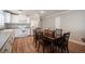 Dining room with hardwood floors, dining table, and white kitchen appliances at 5000 Charlo Dr, Las Vegas, NV 89131