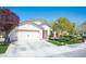 Charming single-story home with a well-manicured lawn and a two car garage at 5000 Charlo Dr, Las Vegas, NV 89131