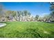 Expansive green space perfect for recreation, surrounded by trees and neighborhood homes, offering a serene environment at 5000 Charlo Dr, Las Vegas, NV 89131