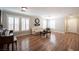 Inviting living room with hardwood floors, neutral walls, and bright, shuttered windows at 5000 Charlo Dr, Las Vegas, NV 89131