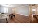 Cozy living room with hardwood floors, neutral walls, and a comfortable-looking couch at 5000 Charlo Dr, Las Vegas, NV 89131