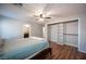 Spacious bedroom features wood floors, closet shelving, and an en suite bathroom at 5000 Charlo Dr, Las Vegas, NV 89131