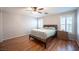 Comfortable primary bedroom featuring wood floors, a ceiling fan, and great natural light at 5000 Charlo Dr, Las Vegas, NV 89131