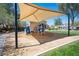 Neighborhood playground area with sunshade, playground equipment and safety surfacing offering fun in the sun at 5000 Charlo Dr, Las Vegas, NV 89131