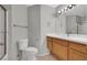 Clean bathroom with a single sink vanity, white countertop, and a walk-in shower at 5244 Velazco Ln, Las Vegas, NV 89130