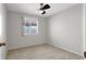 Comfortable bedroom with neutral carpet, ceiling fan, and window allowing natural light at 5244 Velazco Ln, Las Vegas, NV 89130