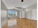 Bright living room with large windows, and hardwood flooring throughout at 5244 Velazco Ln, Las Vegas, NV 89130