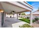 Large covered patio with ceiling fans, artificial grass, and a garden at 5244 Velazco Ln, Las Vegas, NV 89130