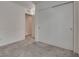 Simple bedroom with neutral tones, soft carpet, and lots of closet space at 5256 Sherwood Forest Ln, Las Vegas, NV 89122