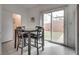Eat in dining area, table for four with backyard views through sliding glass door at 5256 Sherwood Forest Ln, Las Vegas, NV 89122