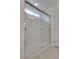 This shower features glass doors, a handheld shower head and a tile floor at 5256 Sherwood Forest Ln, Las Vegas, NV 89122