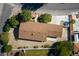 Aerial view of the house featuring roof details and surrounding landscaping at 5518 Avenida Vaquero, Las Vegas, NV 89108