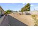 Spacious backyard with desert landscaping and a brick walkway for a low-maintenance design at 5518 Avenida Vaquero, Las Vegas, NV 89108