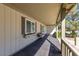 Inviting covered front porch with a cozy sitting area and charming details at 5518 Avenida Vaquero, Las Vegas, NV 89108