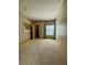 Neutral bedroom with carpet, blue curtains, large window and walk-in closet at 5525 W Flamingo Rd # 2037, Las Vegas, NV 89103