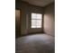 A bright bedroom featuring neutral carpet and a window letting in natural light at 5525 W Flamingo Rd # 2037, Las Vegas, NV 89103