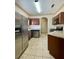 Spacious kitchen featuring stainless steel appliances, granite countertops and tile floors at 5525 W Flamingo Rd # 2037, Las Vegas, NV 89103