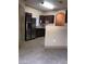 The kitchen offers stainless steel appliances and tile floors with dark wooden cabinetry at 5525 W Flamingo Rd # 2037, Las Vegas, NV 89103