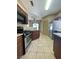 Open kitchen featuring stainless steel appliances, granite countertops and tile floors at 5525 W Flamingo Rd # 2037, Las Vegas, NV 89103