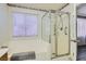 Bathroom featuring a soaking tub and glass enclosed shower stall at 6048 Pele St, North Las Vegas, NV 89031