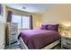 Bedroom features a stylish wood bed frame and complementary wooden nightstands at 6048 Pele St, North Las Vegas, NV 89031
