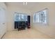 Bonus room featuring tile floors, ceiling fan, and decorative window treatments at 6048 Pele St, North Las Vegas, NV 89031