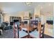 Open-concept dining area with wooden table and chairs, seamlessly connected to the living room and kitchen at 6048 Pele St, North Las Vegas, NV 89031