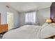 Comfortable main bedroom with a closet leading to the bathroom at 6048 Pele St, North Las Vegas, NV 89031
