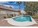 Private pool featuring a tile roof home and mature landscaping at 6048 Pele St, North Las Vegas, NV 89031