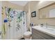 Bathroom with a floral shower curtain, a gray vanity, and a stylish mirror at 6072 Canter Glen Ave, Las Vegas, NV 89122