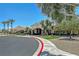 Beautiful community center with lush landscaping, mature trees, and elegant architectural features at 6072 Canter Glen Ave, Las Vegas, NV 89122