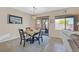 Cozy dining area with natural light, stylish decor, and easy access to the backyard patio at 6072 Canter Glen Ave, Las Vegas, NV 89122