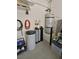 Garage featuring a water filtration system, added organization, and other utility components at 6072 Canter Glen Ave, Las Vegas, NV 89122