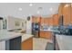 Modern kitchen featuring updated appliances, tile backsplash, and a breakfast bar area for casual dining at 6072 Canter Glen Ave, Las Vegas, NV 89122