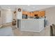 Well-lit kitchen featuring modern appliances, tile backsplash, and a breakfast bar at 6072 Canter Glen Ave, Las Vegas, NV 89122