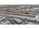 Aerial view of a residential community featuring modern homes, solar panels, a neighborhood pool, and landscaping at 6148 Juniper Grove St, Las Vegas, NV 89148