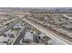 Extensive aerial view showcasing a neighborhood's layout, modern homes, and green spaces at 6148 Juniper Grove St, Las Vegas, NV 89148