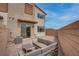 Backyard with a private patio, outdoor seating, brick wall, and sliding glass door access to the home at 6148 Juniper Grove St, Las Vegas, NV 89148