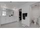 Elegant bathroom with dual sinks, white cabinets, and a doorway to a walk-in closet at 6148 Juniper Grove St, Las Vegas, NV 89148