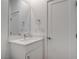 Modern powder room with white vanity, faucet, and mirror at 6148 Juniper Grove St, Las Vegas, NV 89148